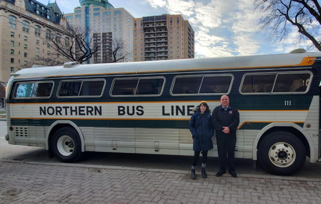 Emily and John infront of Greyhound Bus