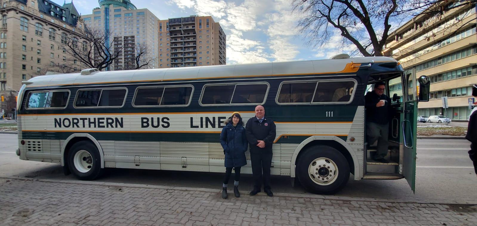 Emily and John infront of Greyhound Bus